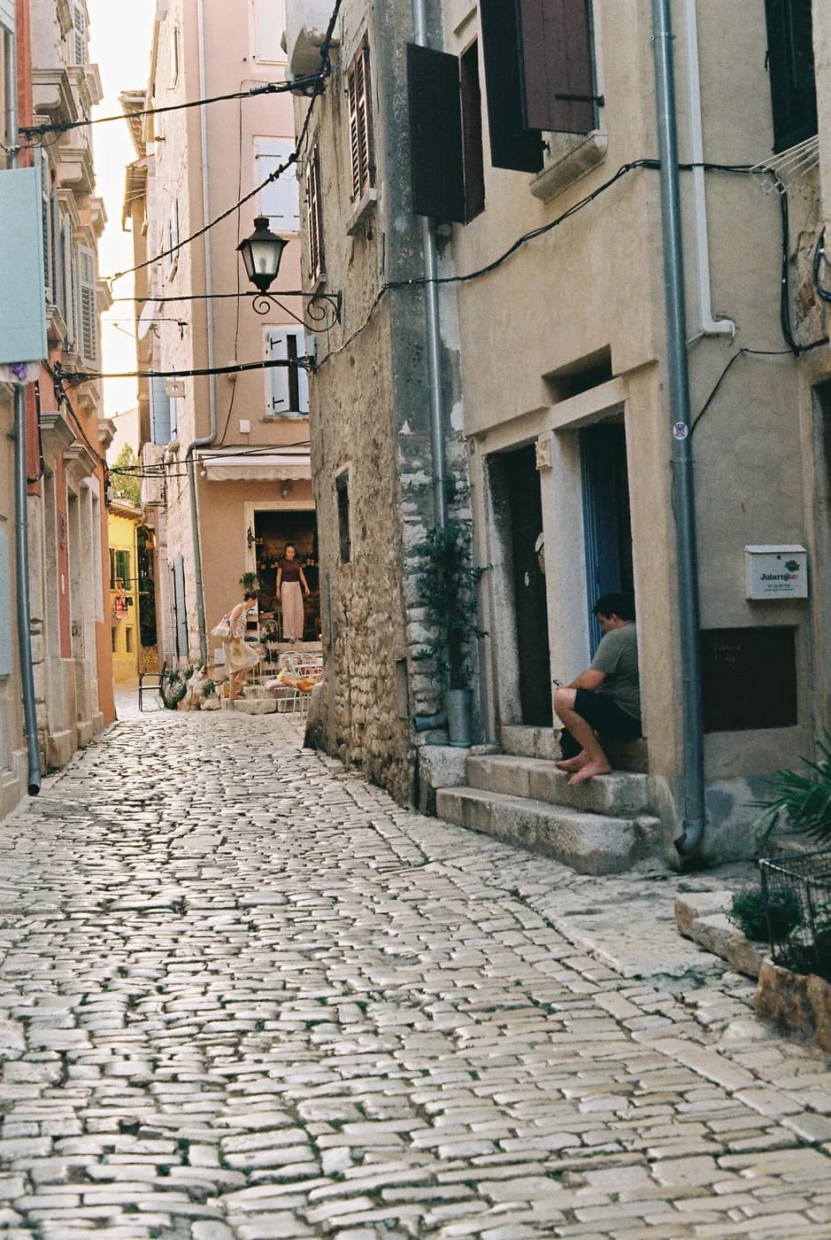 Stone-fronted buildings along a cobbled street